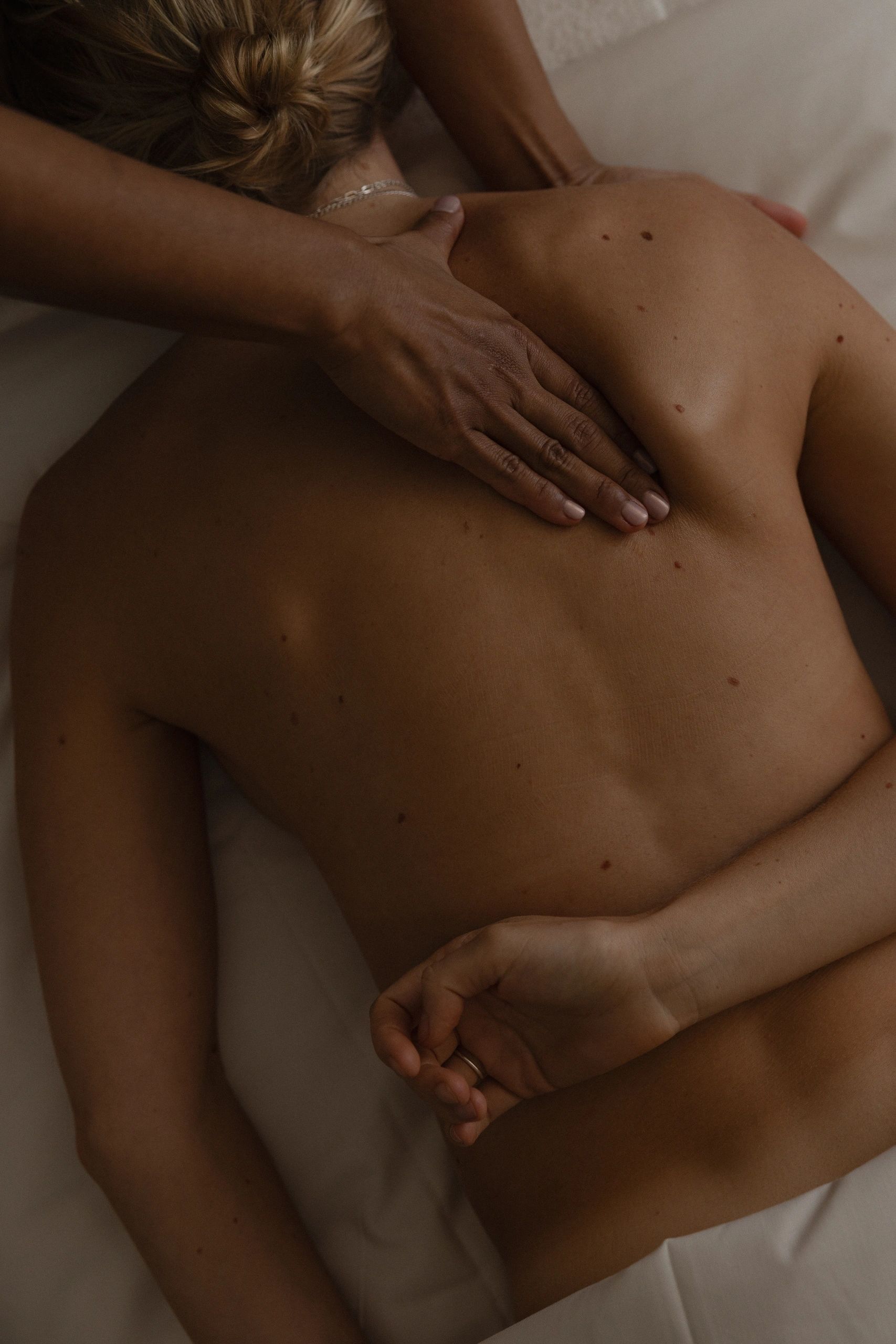 Therapist performing a back massage